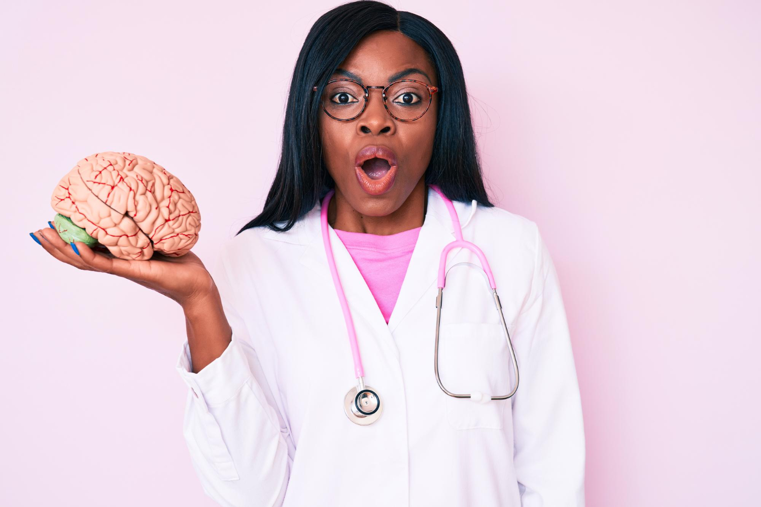 young-african-american-woman-wearing-doctor-coat-holding-brain-scared-amazed-with-open-mouth-surprise-disbelief-face